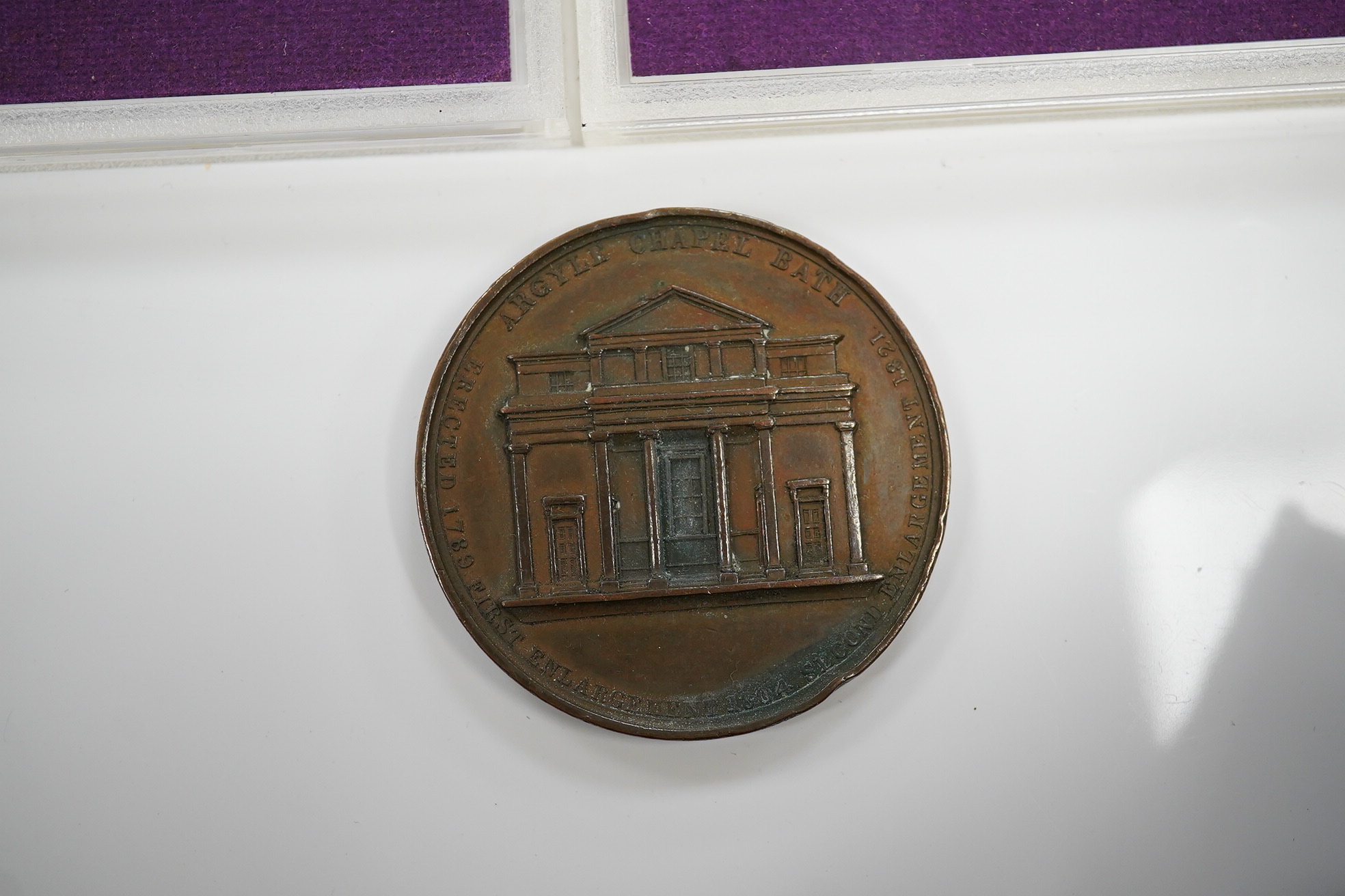 A small collection of coins including two 1970 proof sets, a 1953 set, a George III crown, a 1933 George V crown and a medallion for the Argyle Chapel, Bath. Condition - fair